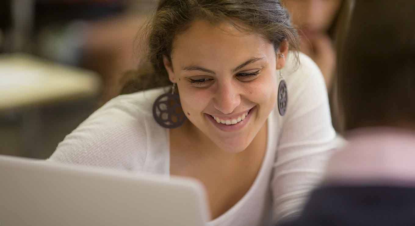 student using a laptop in class